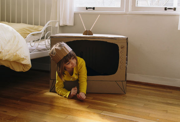 Child playing in box